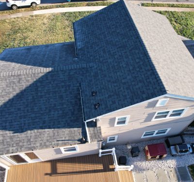 Aerial View Of A New Roof On A Brown Home