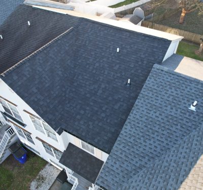 A Residential Home With A New Roof Installed By Class Roofing